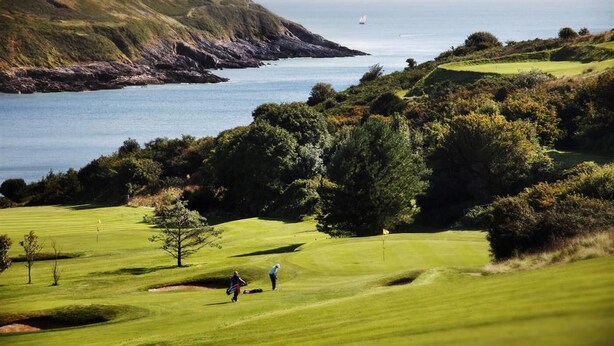 A coastal golf course with a view of the sea and hills. - 4 Bed in Langland (oc-hh36) (Newton)