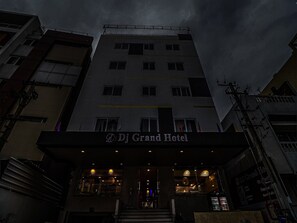 A hotel with a sign reading 'Dj Grand Hotel' at the entrance. - Townhouse DJ Grand (Tirupati)