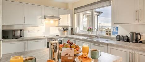 Oven, dishwasher, high chair, cookware/dishes/utensils