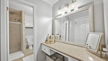 Shower, hair dryer, towels, soap