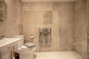 A bathroom with a toilet, sink, and shower area. - 3 Bed in Tideswell (oc-f35061) (Tideswell)