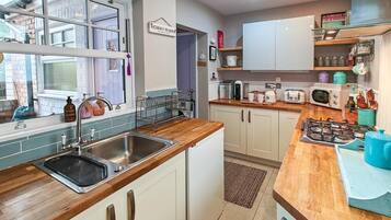 Oven, dishwasher, high chair, cookware/dishes/utensils