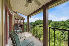 A balcony with a view of a forested area. - Spacious 3-bedroom condo with River and Mountain Views (Sevierville)