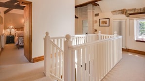 A hallway with a white railing, a radiator, and a window with a view. - 3 Bed in Wirksworth (oc-dchenm) (Hopton)