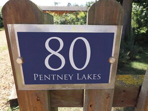 A wooden sign with the number 80 and the text 'PENTNEY LAKES' on it. - 80 Pentney Lakes (King's Lynn)