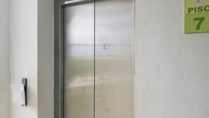 A closed elevator door with a wall-mounted sign indicating room number 7. - Lovely apt with 2 BR and Two balcony with sea view (La Romana)