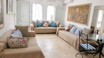 Appartement Familial, balcon, vue jardin | Coin séjour