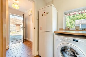 A laundry area with a washing machine and a refrigerator. - 1 Bed in Parkmill (oc-t36337) (Parkmill)