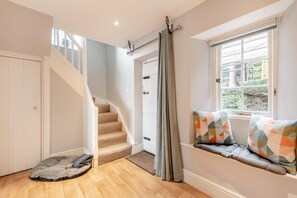 A staircase leading to a landing, a window with a view, and a pet bed. - 2 Bed in St. Mellion (oc-q36012) (Landulph)