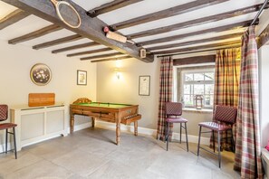 A room with a pool table, two chairs, a radiator, and a window with curtains. - 4 Bed in Norwood (oc-b35549) (Norwood)
