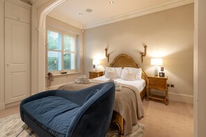 A hotel room with a bed, bedside tables, a chair, a window with blinds, and a door. - 2 Bed in Crook O Lune (oc-r36290) (Halton)