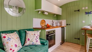 A compact kitchen with a built-in oven, a sink, and a wooden countertop. - 1 Bed in Marden (oc-c34994) (Horsmonden)