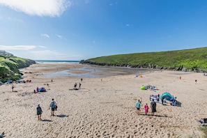 A sandy beach with tents and people. - 4 Bed in Padstow (oc-c27973) (Padstow)