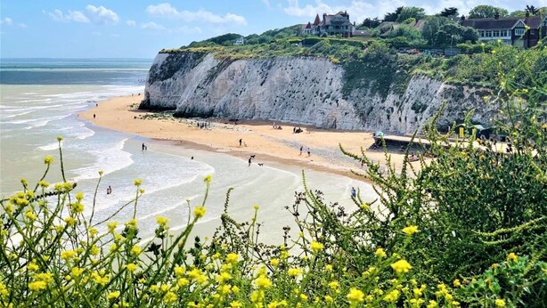 A coastal landscape with a beach, cliffs, and a house on a hill. - 4 Bed in Broadstairs (oc-81104) (Broadstairs)