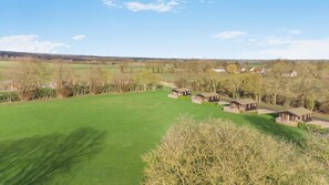 A golf course with several wooden cabins. - 2 Bed in Athelington (oc-a35072) (Athelington)