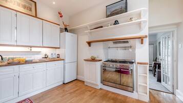 Oven, dishwasher, high chair, cookware/dishes/utensils
