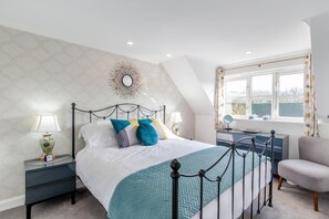 A bedroom with a bed, nightstands, a desk, and a chair. - 2 Bed in Notter (oc-k39063) (Notter)