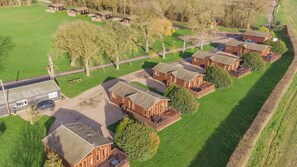 A residential area with multiple brick houses, each with a front porch and a driveway. - 1 Bed in Athelington (oc-w35077) (Athelington)