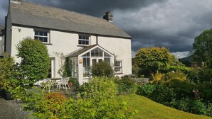 A two-story house with a garden in front. - 3 Bed in Chapel Stile (oc-lr202) (Chapel Stile)