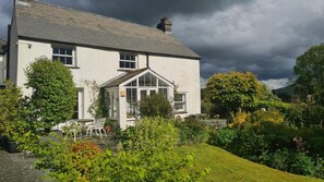 A two-story house with a garden in front. - 3 Bed in Chapel Stile (oc-lr202) (Chapel Stile)