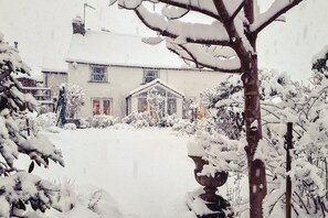 A snow-covered house with a visible front door and windows. - 3 Bed in Chapel Stile (oc-lr202) (Chapel Stile)