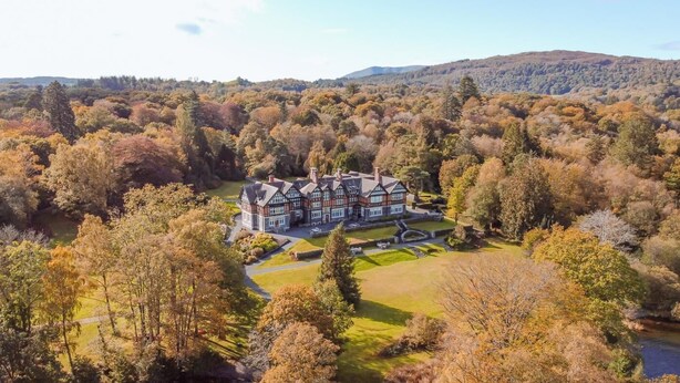 A large, historic house surrounded by a forested landscape. - 3 Bed in Ambleside (oc-lr223) (Claife)