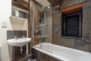 A bathroom with a glass-enclosed shower, a white sink, and a bathtub. - 1 Bed in Ambleside (oc-lr163) (Ambleside)