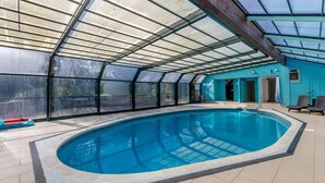 A covered swimming pool with a glass ceiling, a blue exterior wall, and a tiled floor. - 2 Bed in Fowey (oc-p00761) (Fowey)
