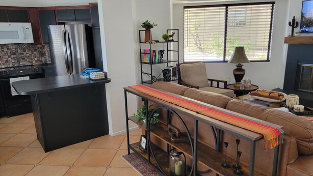 A modern kitchen with a built-in microwave, refrigerator, and stove. - Peaceful and quiet 1-bedroom condo with AC in charming Borrego Springs (Borrego Springs)
