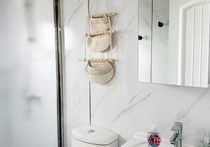 Shower, towels, soap, toilet paper - Private Studio Suite with Queen and Bunk Beds, Full Kitchen and In-Unit Laundry (Pecos)