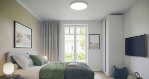 A bedroom with a bed, a bedside table with a lamp, a TV on the wall, and two framed pictures. - Vrbo Property (Grömitz)