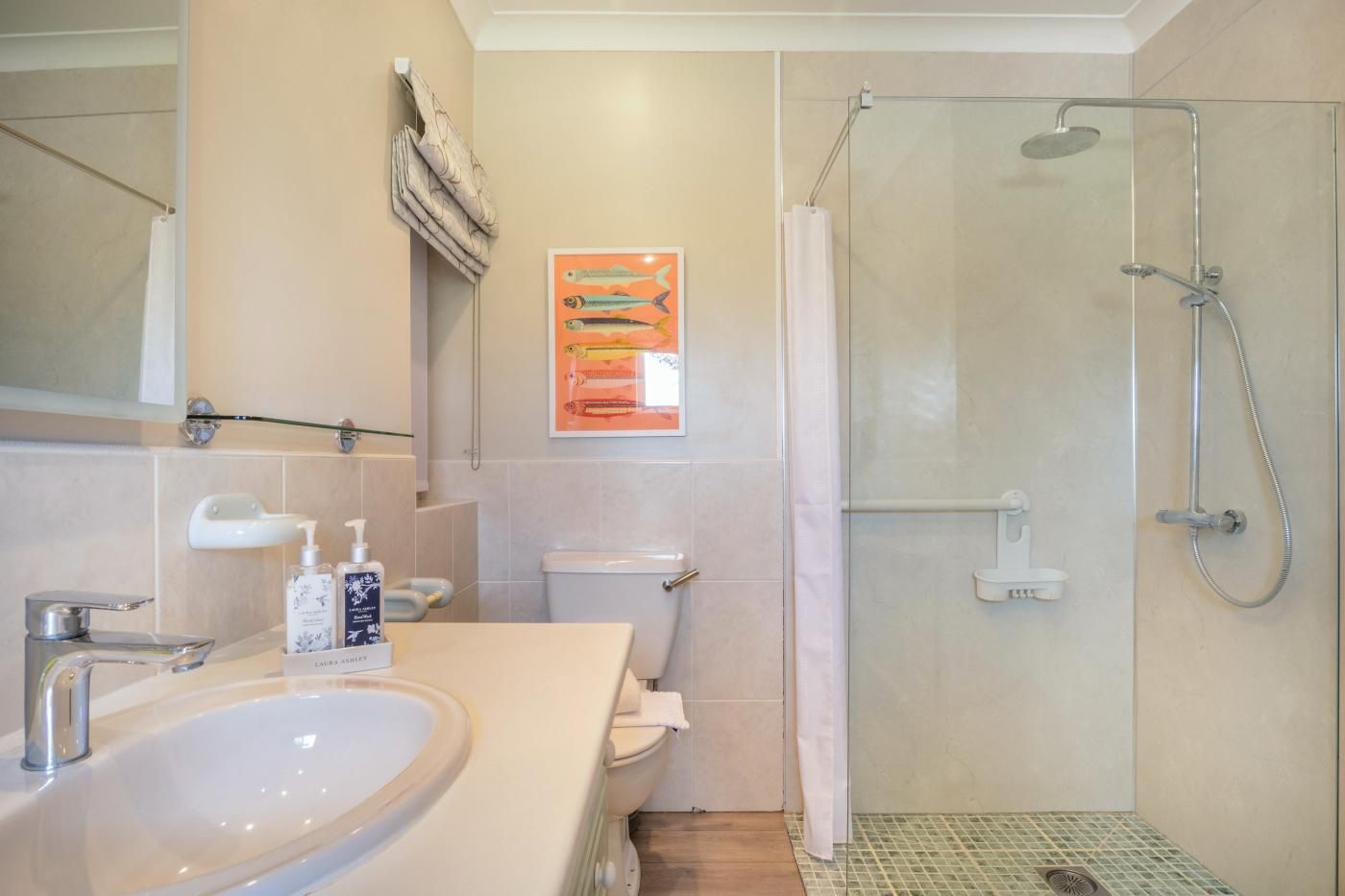 A bathroom with a bathtub, toilet, and shower.
