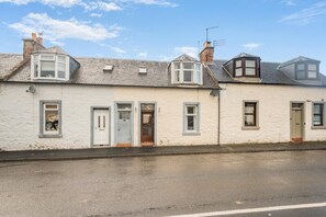 A row of terraced houses with pitched roofs, small windows, and doors. - 2 Bed in Dalrymple (oc-b40270) (Dalrymple)