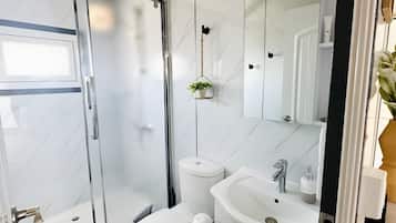 Shower, towels, soap, toilet paper