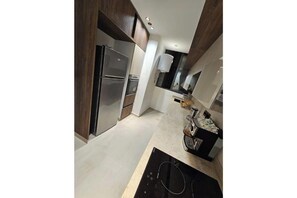 Private kitchen - Appart Nina | Digital Access | 9 min to the TGV Station • Steps from CTM (Tanger)