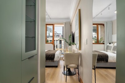 Charlie and the Chairman | Modern CBD Apartment