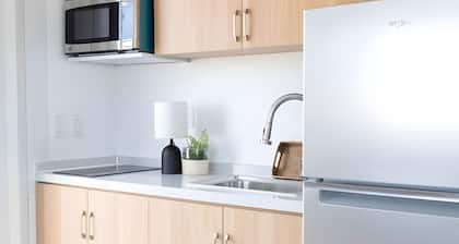 Private Duplex Studio Suite with Queen Bed, Kitchenette and Private Bathroom.