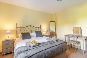 A bedroom with a bed, bedside tables, a desk with a chair, and a mirror. - 2 Bed in Westport (oc-c42687) (Westport)
