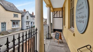 A building with a sign reading 'Llety's Barnwr The Judge's Lodging' and a chalkboard sign advertising 'ALL LOCAL PRODUCE.' - 1 Bed in Presteigne (oc-t38200) (Presteigne)