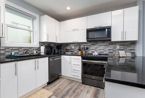 Coffee/tea maker, fridge, microwave, oven - Rear Top | Ocean views & steps from the sand (Jacksonville Beach)
