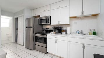 Fridge, stovetop, coffee/tea maker, cookware/dishes/utensils