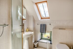 A bathroom with a glass shower enclosure, a white sink, a toilet, and a skylight. - 2 Bed in Dwrbach (oc-w42727) (Dwrbach)