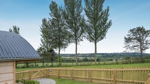 A wooden deck with a view of a rural landscape. - 2 Bed in Adgestone (oc-i42801) (Brading)