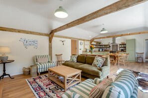 A spacious living room with a sofa, armchairs, a coffee table, and a patterned rug. - 2 Bed in Hartest (oc-w42830) (Hartest)