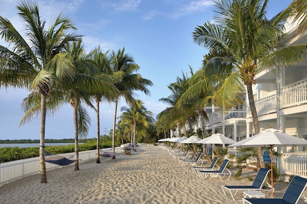 Stretch out on shaded loungers just steps from the water.