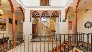 A grand staircase with ornate railings and a view of a lower level. - Country House 'La Florida' with Shared Pool, Wi-Fi and Air Conditioning (Los Menas)