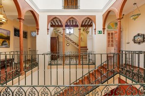 A grand staircase with ornate railings and a view of a lower level. - Country House 'La Florida' with Shared Pool, Wi-Fi and Air Conditioning (Los Menas)