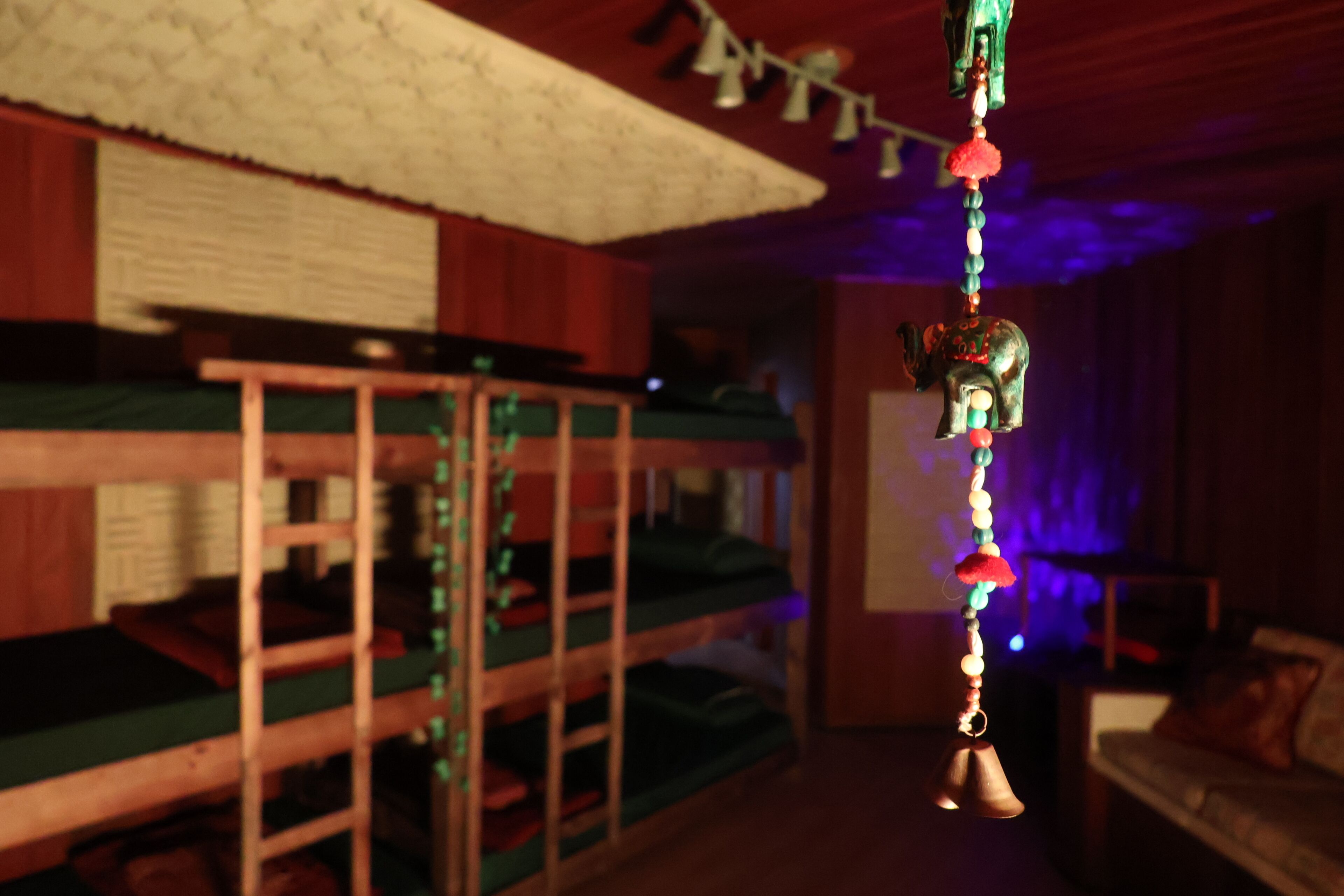 A bunk bed room with a hanging ornament.