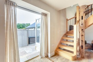 A staircase with wooden steps and metal railings, leading to an upper floor. - 1 Bed in Bardwell (oc-l44860) (Bardwell)