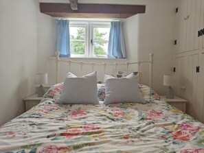 A bedroom with a bed, two bedside lamps, a window with curtains, and a wooden ceiling beam. - 2 Bed in Kingston (oc-s43307) (Kingston)
